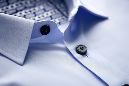 Closeup view of stylish light blue shirt. Dry-cleaning service