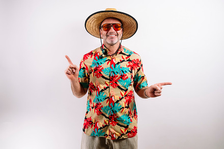 Tourist man pointing fingers in different directions