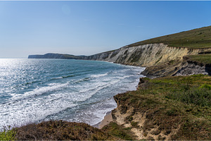 Eroding cliffs into the ocean in, a Nature Photo by Backyard Stock