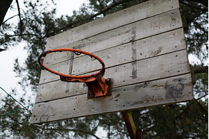 old basketball hoop without net in