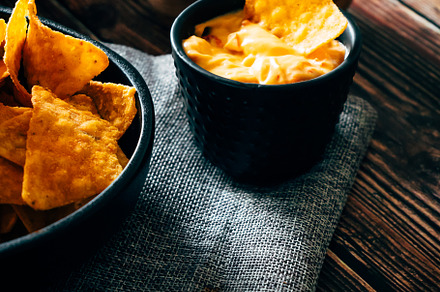 Mexican nachos with guacamole, cheddar cheese and chili.