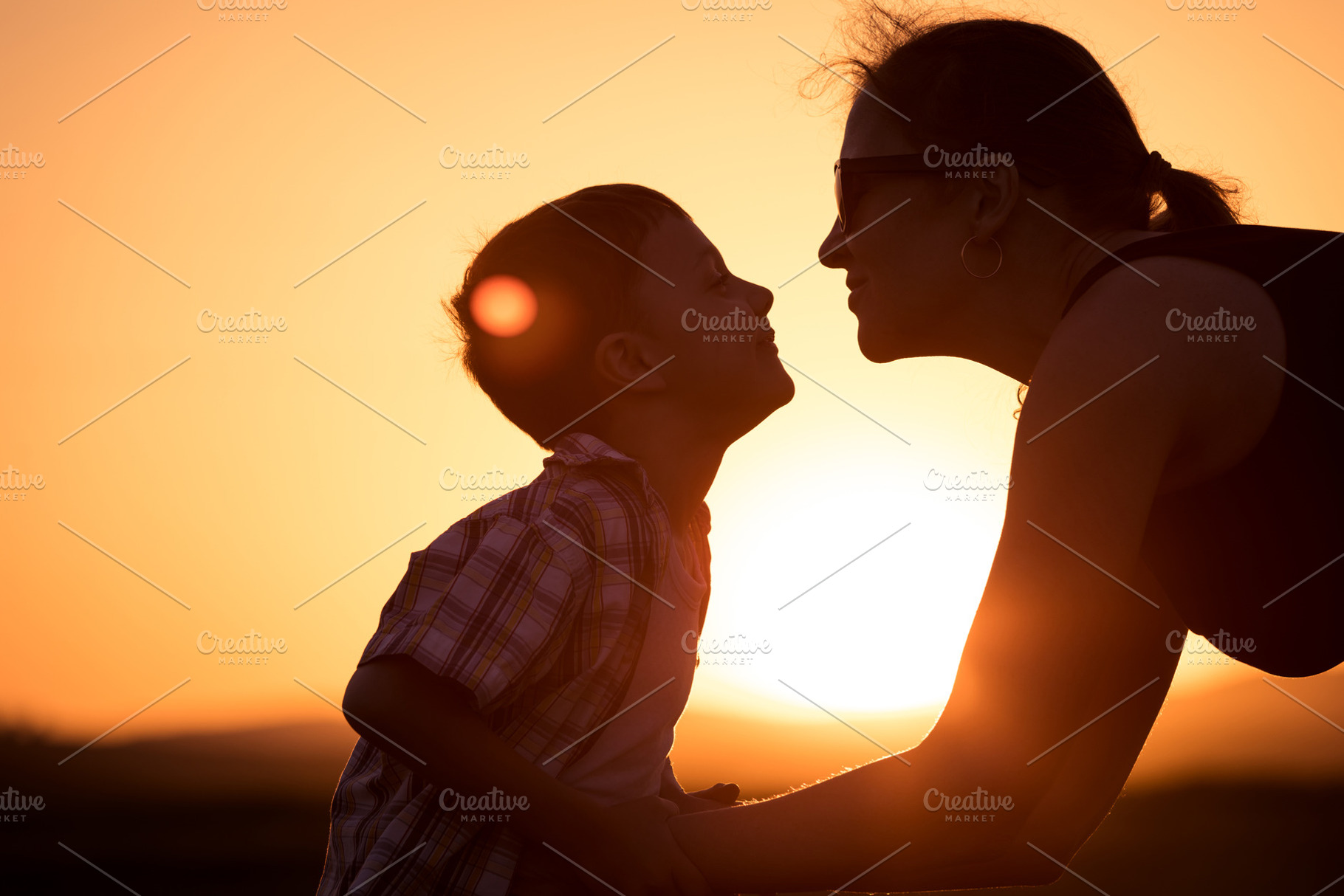 Mother and son walking on the field stock photo containing outdoor and travel, a Person Photo by altanaka