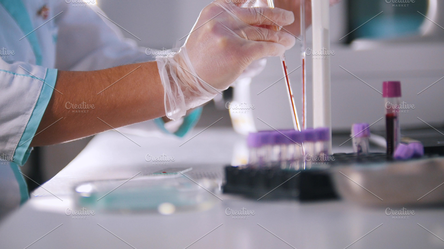 A woman is analyzing a blood in, a Person Photo by Barcelona_dreams