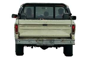 isolated image of pickup truck with three passengers seated insi, a Transportation Photo by DanFLCreativo