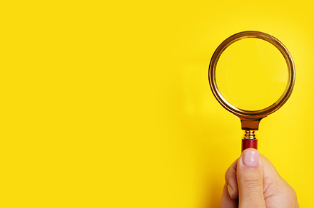 hand holding magnifier panoramic, a Business Photo by Ales Munt
