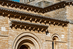 Romanesque stone church under a blue, an Architecture Photo by Perpis