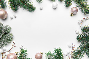 Christmas frame with pine branches and ornaments on white backgr, a Holiday Photo by Olena Rudo