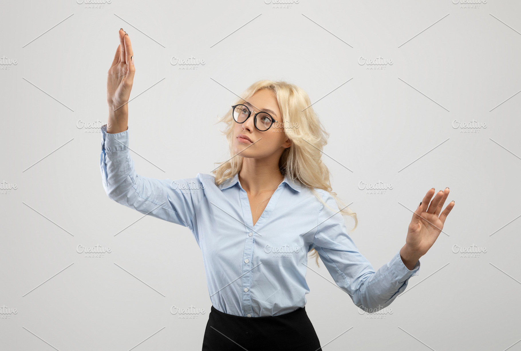 Business innovations concept. Young female entrepreneur touching virtual screen, a Photo by Prostock-Studio