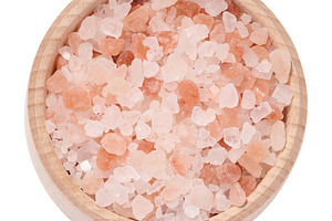 White and pink Himalayan salt in a wooden bowl on a white isolat, a Food & Drink Photo by ndanko