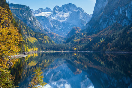 Peaceful autumn Alps mountain lake with clear transparent water, a Nature Photo by YuriyB