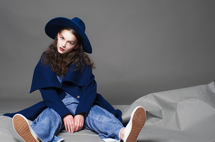 Fashion model woman coat and hat urban style pose on color background in, a Beauty & Fashion Photo by Serovphoto