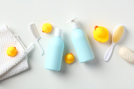 Set of newborn baby shampoo, body wash, towel, yellow rubber ducks, body brush,, a Health & Medical Photo by photoguns