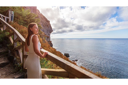 Young woman standing at tourist path, a Person Photo by serkum