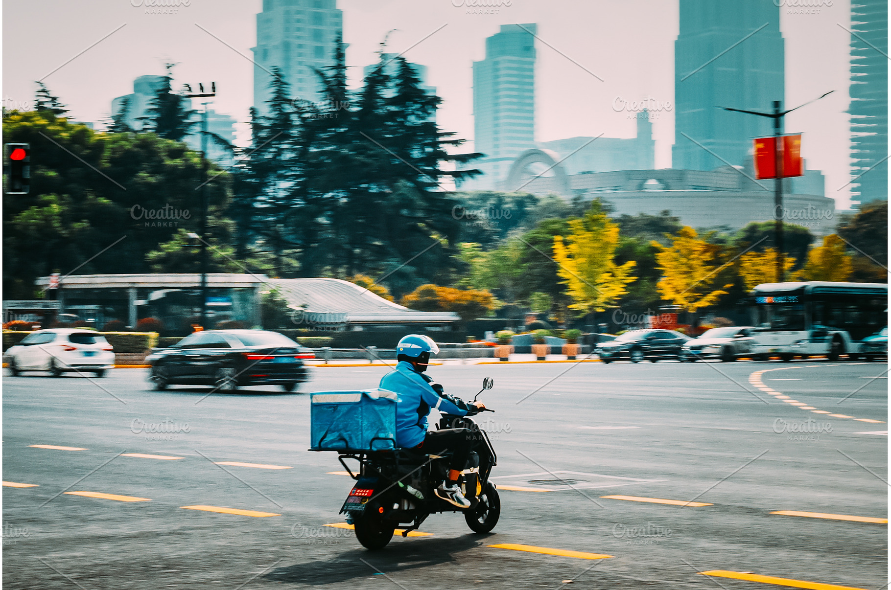 City scene with motorcycles, buses, an Architecture Photo by Our Amazing World