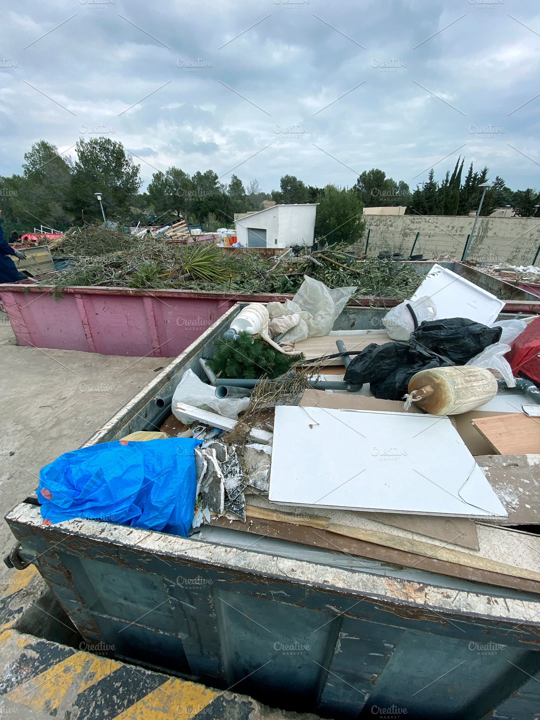 a container with mixed bulky waste at a recycling facility, a Photo by Nito