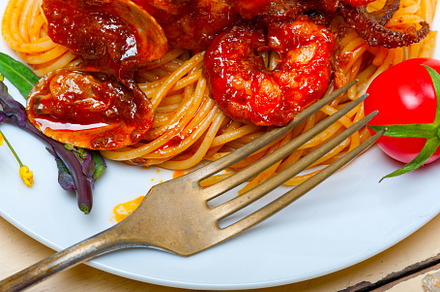 Italian seafood spaghetti pasta on red tomato sauce, a Food & Drink Photo by keko64