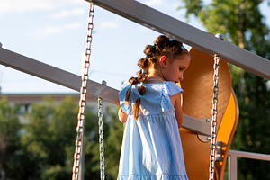 Braided Girl Climbs Playground Slide, a Person Photo by Elena Vagengeim