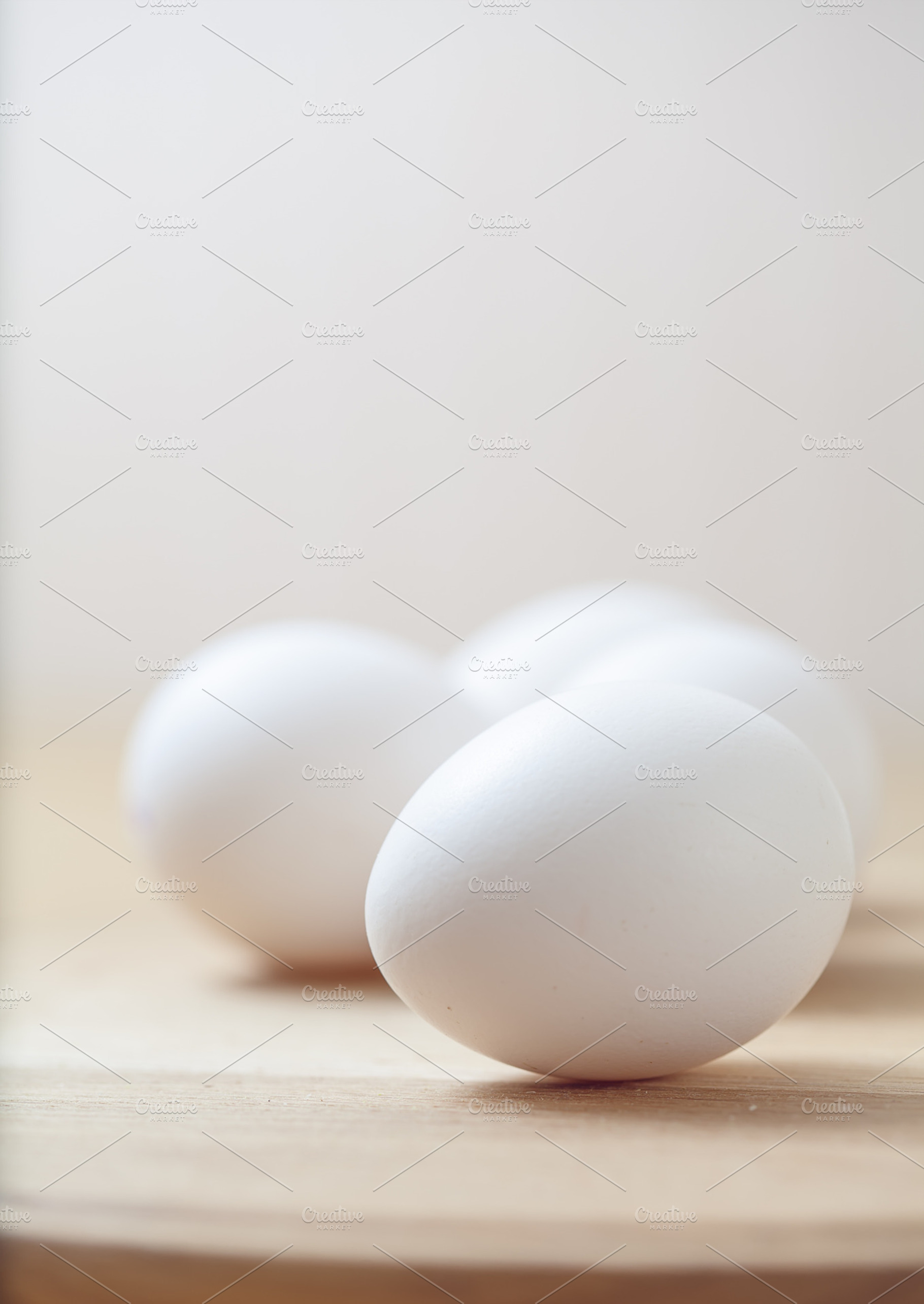 White eggs on the wooden table stock photo containing abstract and air