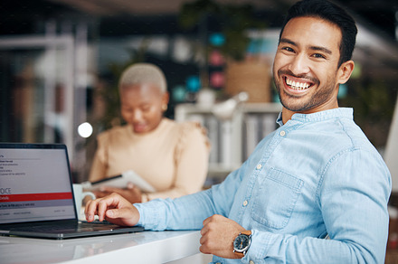 Portrait, smile and business man in office with pride for career, occupation or job. Ceo, night and happy, proud and confident Asian professional entrepreneur sitting at table with laptop in company., a Photo by Peopleimages.com
