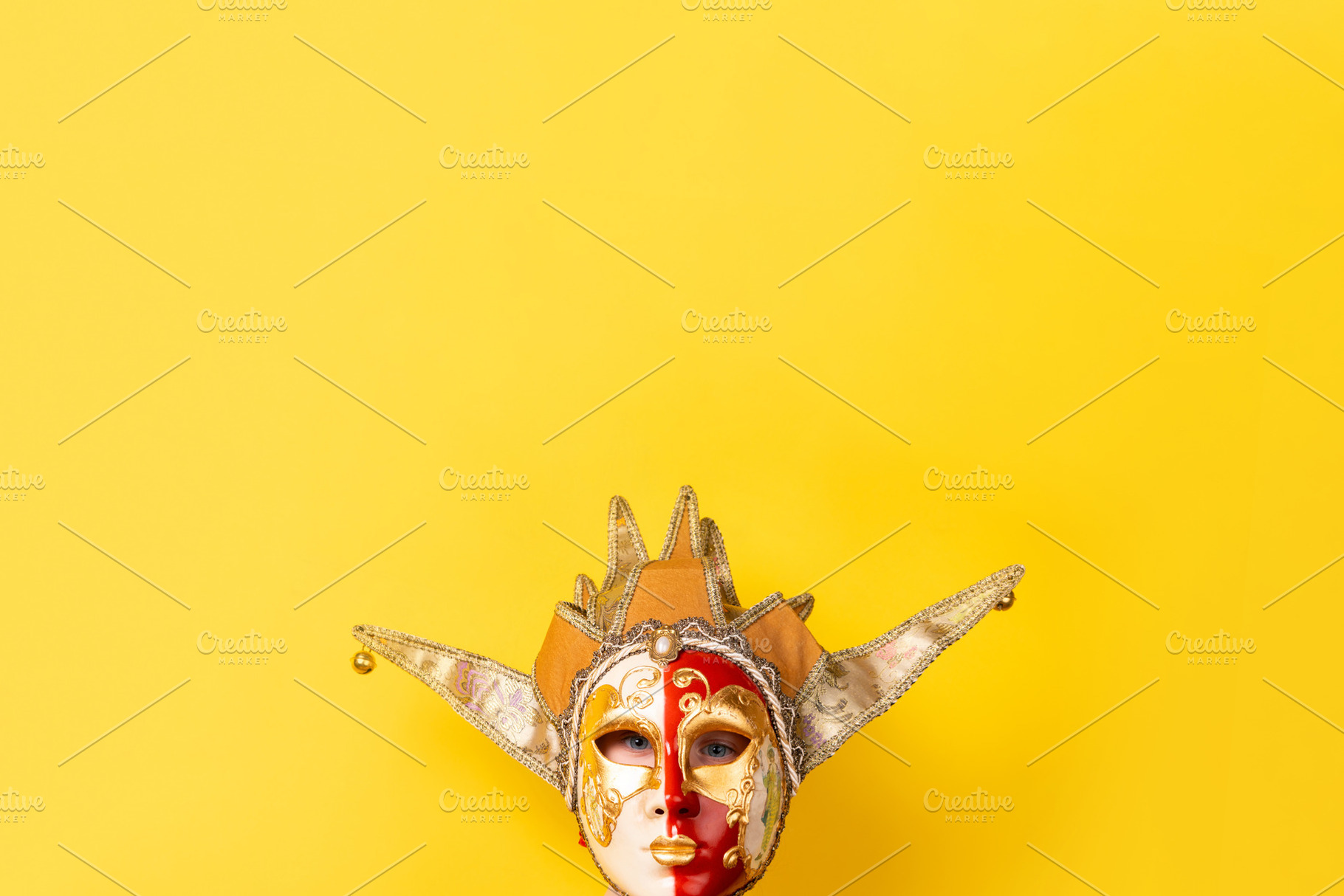 Colorful Venetian jester mask with gold detailing and dramatic d, a Holiday Photo by Ales Munt