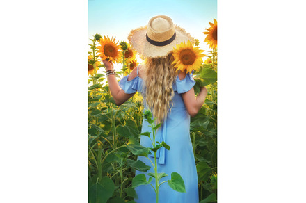 Woman in a field of sunflowers, a Nature Photo by yanadjana
