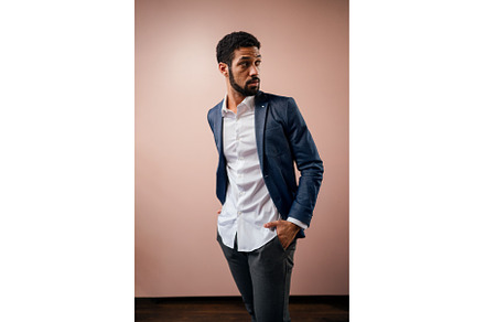 Serious young businessman looking, a Person Photo by HalfPoint