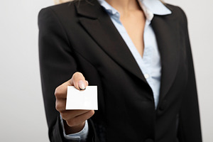 Cropped view of businesswoman giving empty business card with mockup for design, a Photo by Prostock-Studio