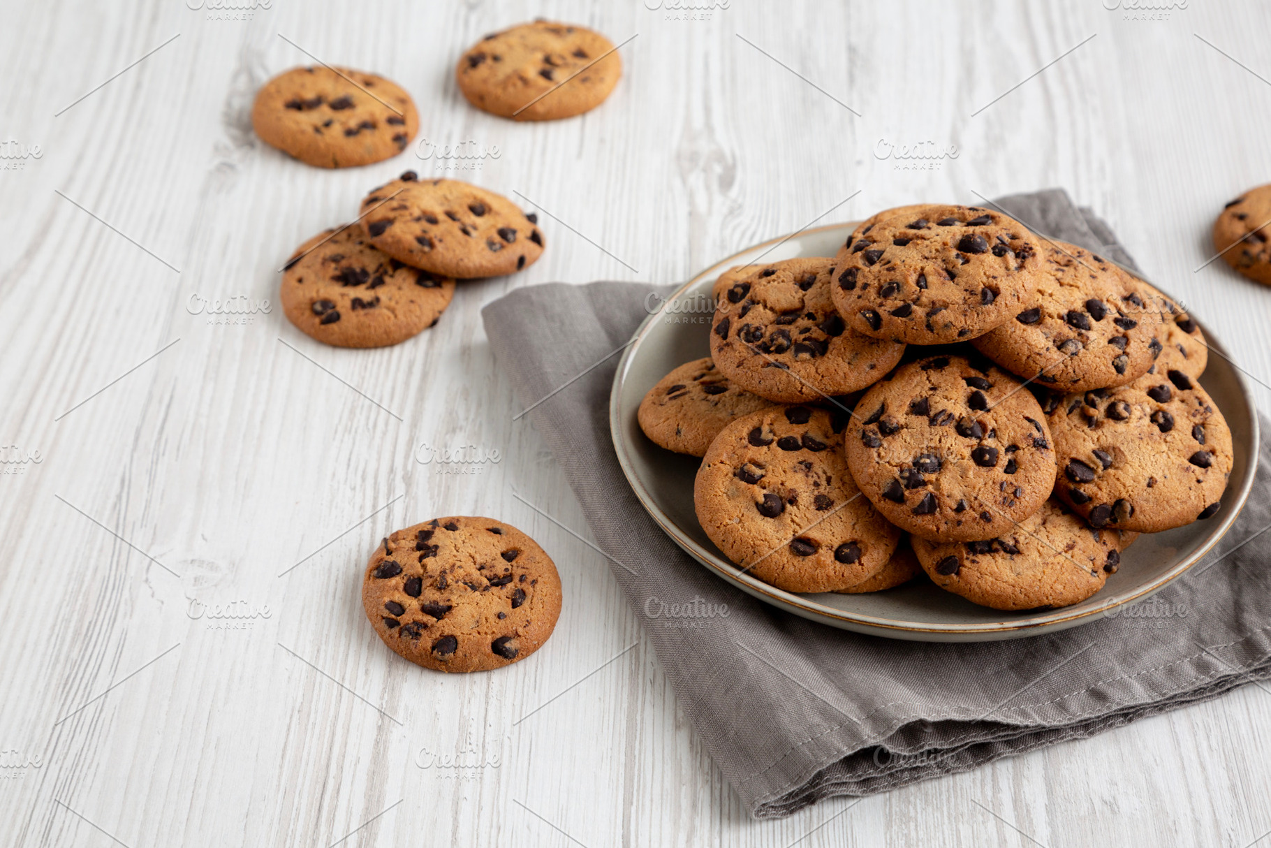 Homemade Chocolate Chip Cookies on a Plate, low angle view. Copy, a Food & Drink Photo by LiudmylaChuhunova