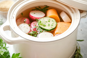 White ceramic pot with fresh vegetab, a Photo by Dvoevnore photos