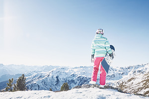 Young woman with snowboard containing active, activity, and adrenaline