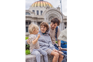 Father tourist with his two sons in, an Architecture Photo by Elizaveta Galitskaya