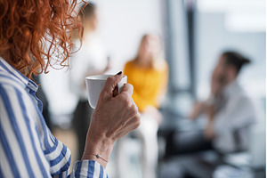 Close up of woman holding coffee in, a Business Photo by HalfPoint