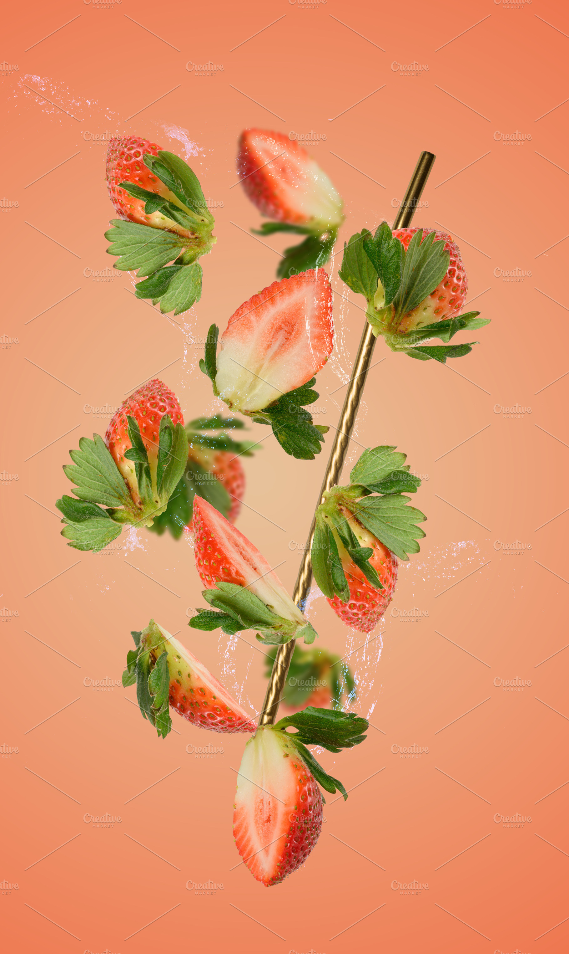 Strawberry halves and splashes of water fly around a golden stra, a Food & Drink Photo by ndanko