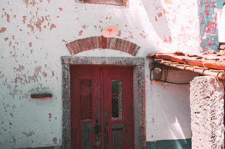 Rustic house with red gate, an Architecture Photo by SkyNext