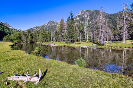 Scenic view of waterfall and lake in