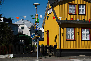 Colorful festive street scene in Akranes, Iceland with Irish celebration decor, a Photo by AS photostudio