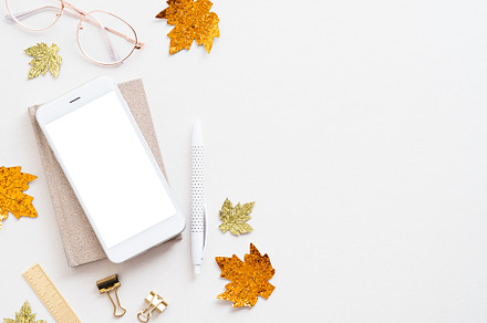 Autumn style workspace with phone, a Technology Photo by photoguns