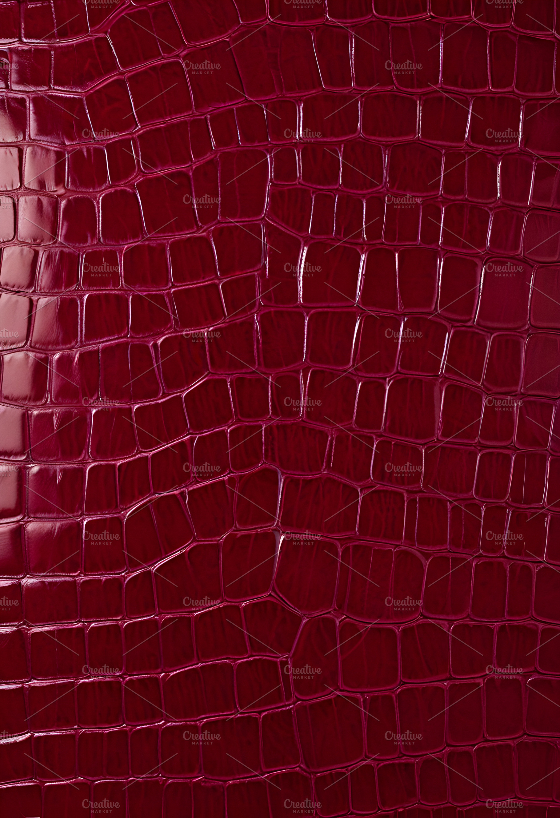 Rich burgundy crocodile leather texture with intricate patterns showcasing luxu, a Background Photo by Kzara Visual Concepts