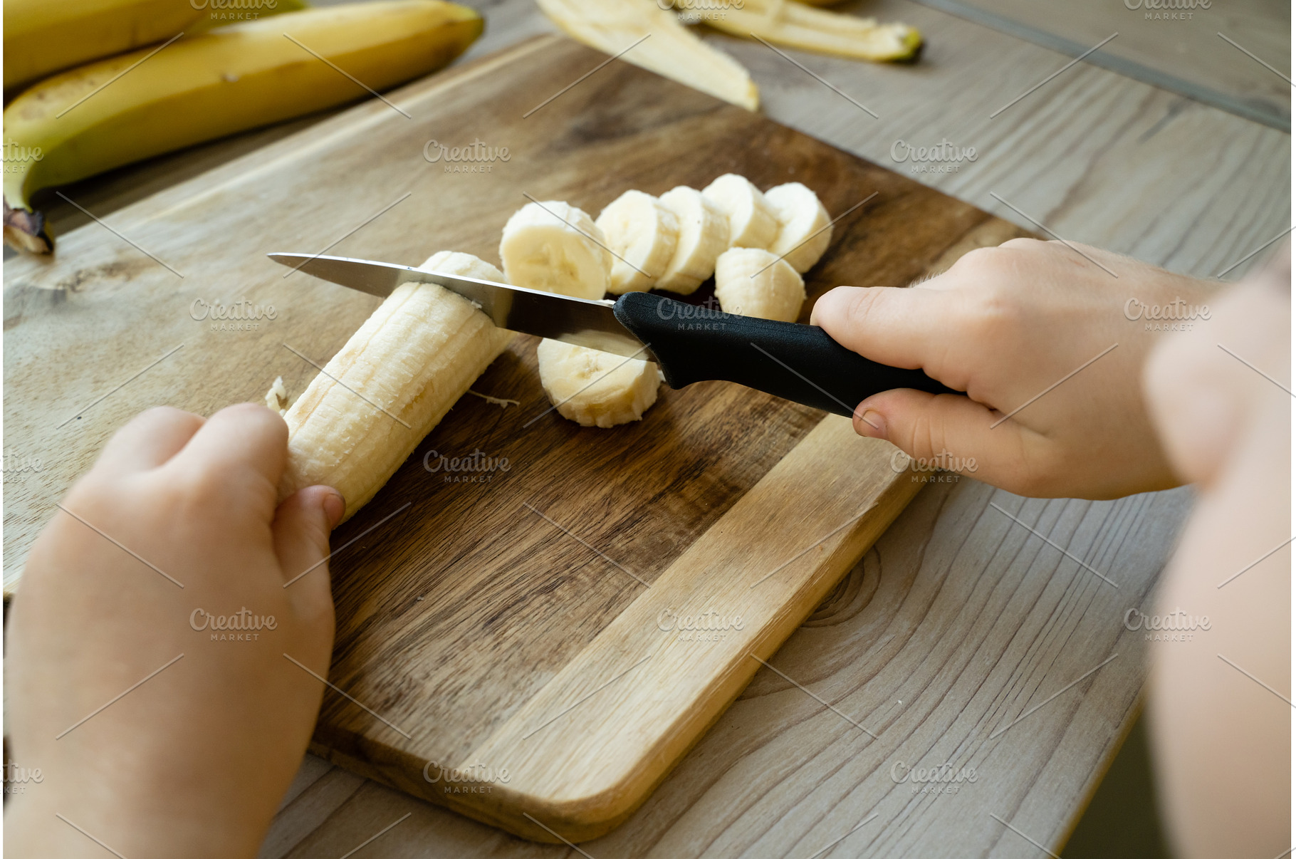 Cutted bananas on the wooden, a Food & Drink Photo by oksix