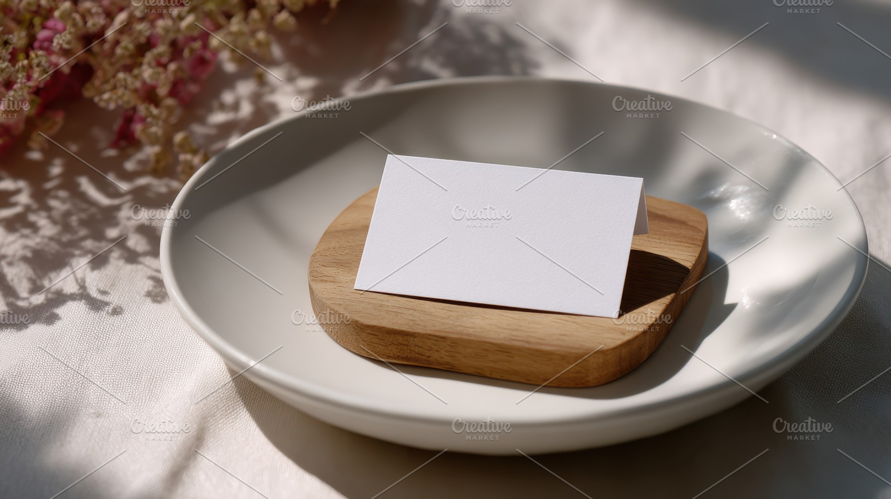 Card on wood plate with flowers, a Photo by Beautiful things