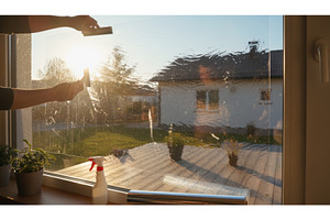 Person applying a plastic film to a, a Nature Photo by Igor Tichonow