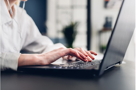 Women's hands typing on keyboard, a Technology Photo by undrey