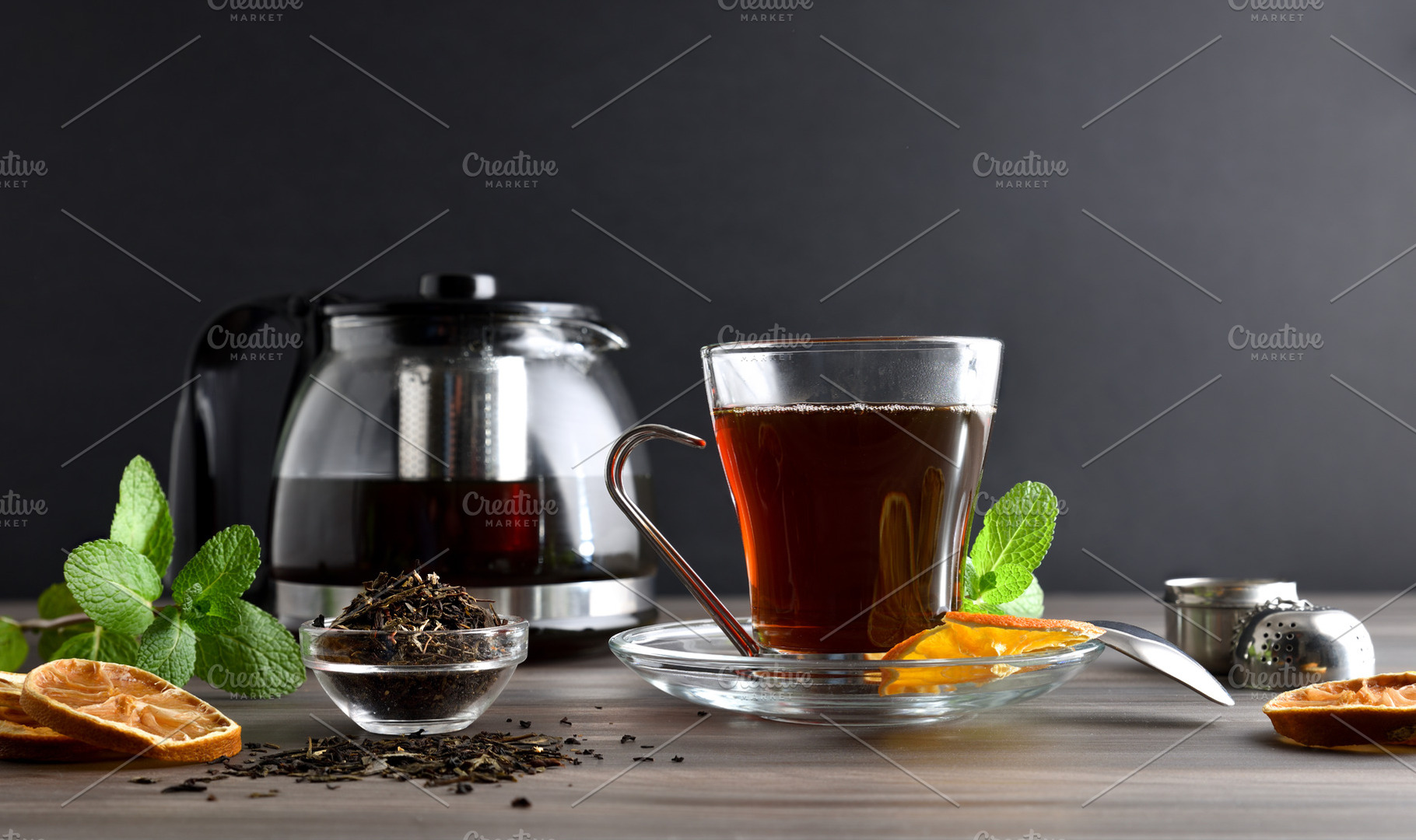 Cup of tea and lemon with dark isolated background, a Food & Drink Photo by Davizro's Market