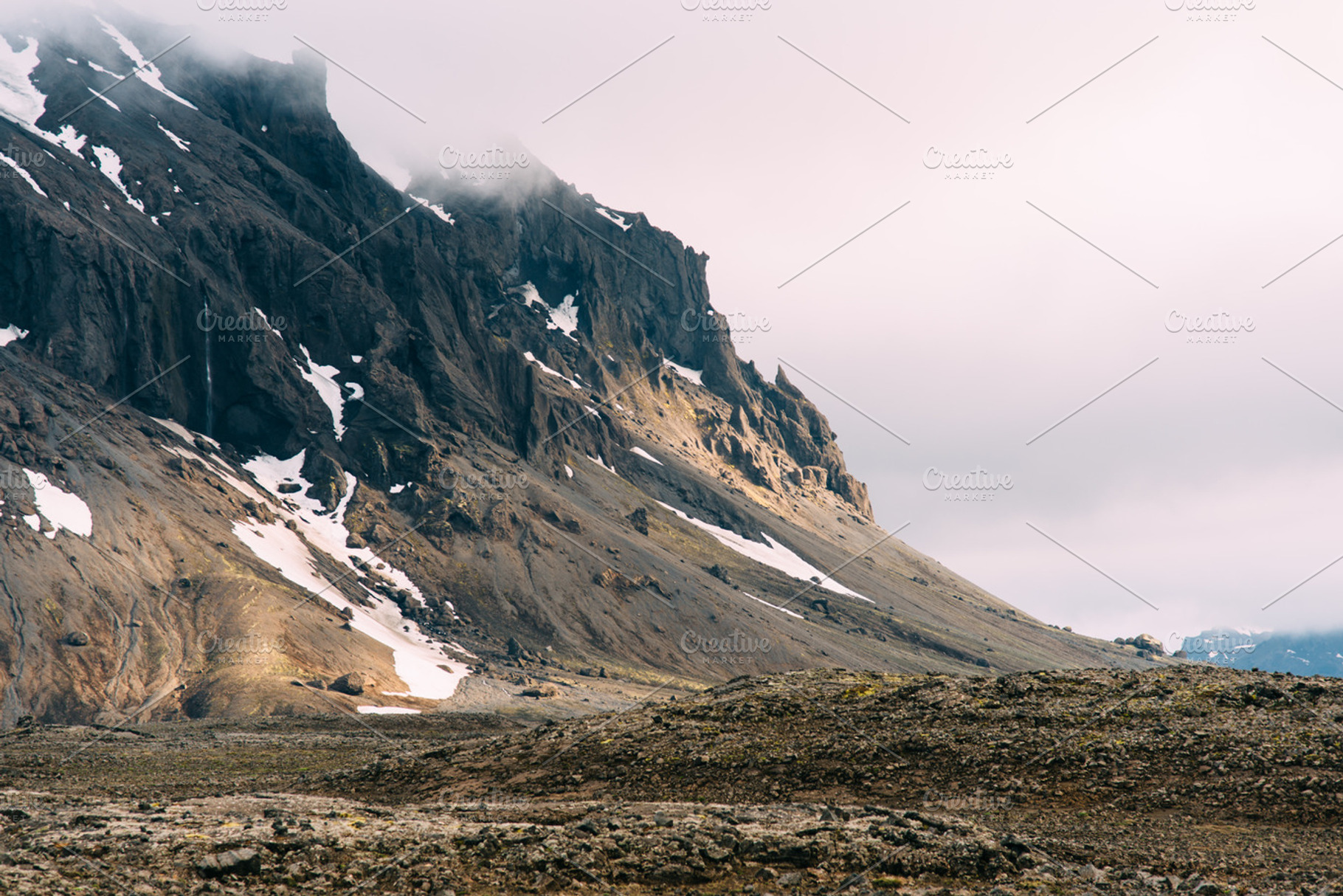 Mountain In The Clouds With Snow