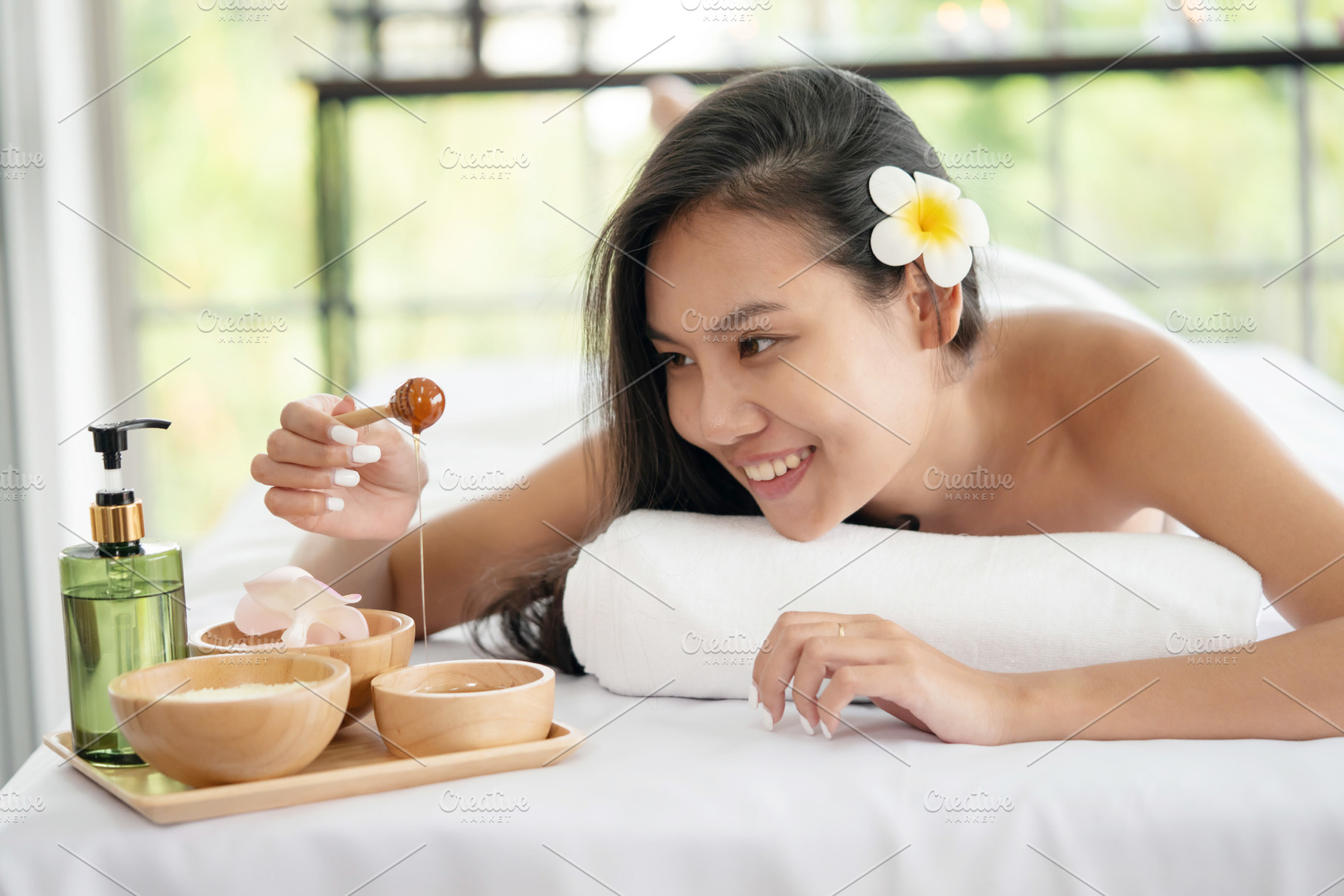 Woman Lying Down on Massage Bed, a Health & Medical Photo by charnsitr