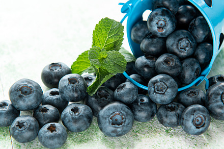 Blueberries on wooden background, a Food & Drink Photo by Olena Rudo