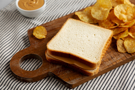Homemade American Peanut Butter Sandwich on a Wooden Board, side