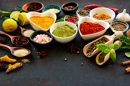 Various spices in a bowls on a black, a Food & Drink Photo by Olena Rudo