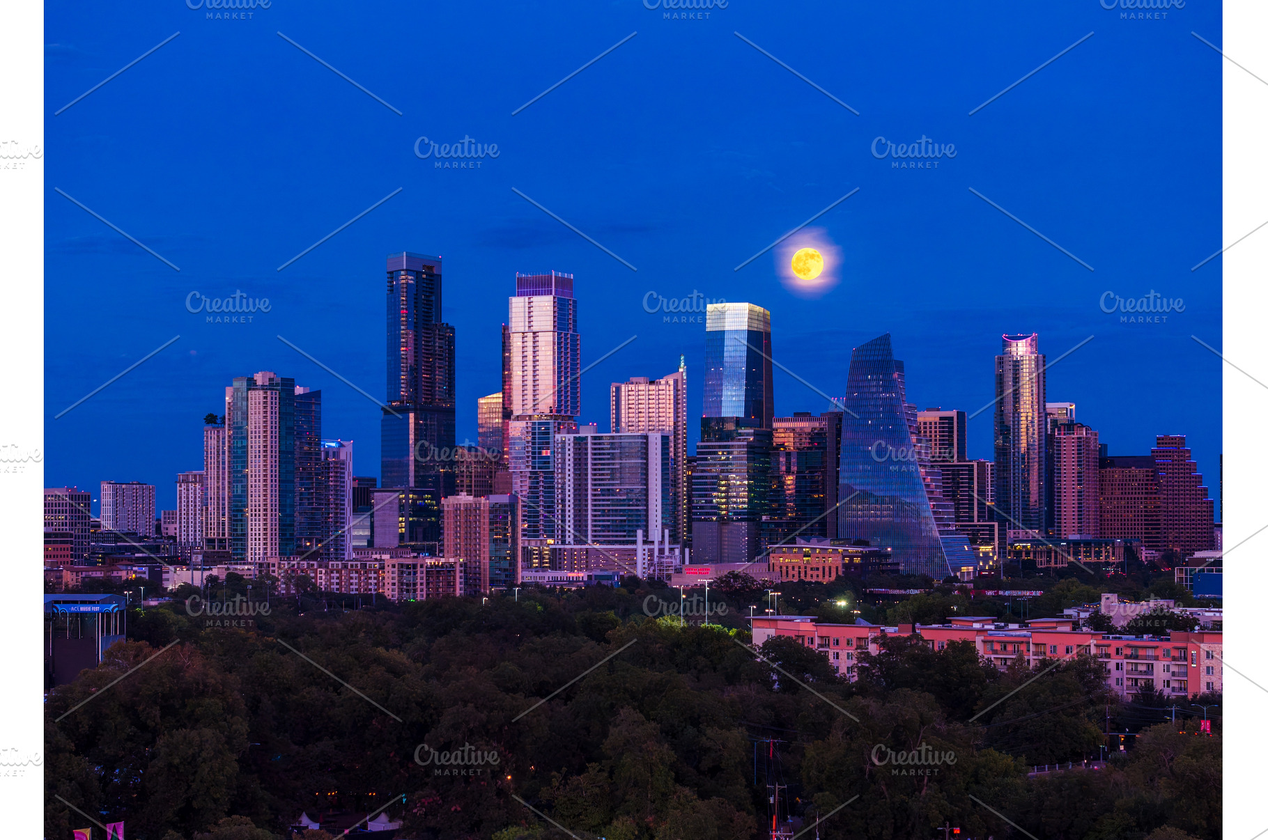Harvest moon in the Austin skyline, an Architecture Photo by Backyard Stock
