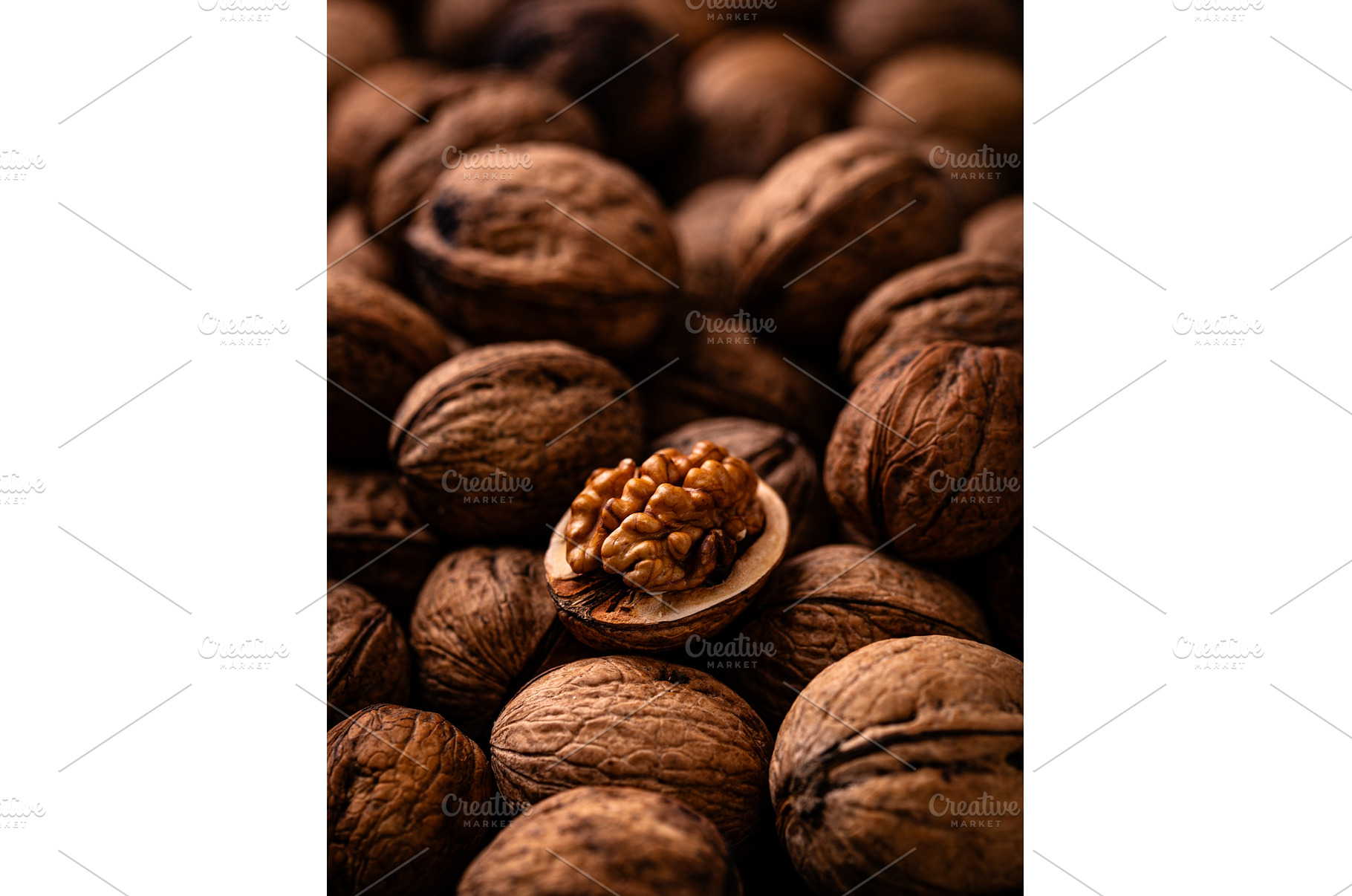 Walnuts with cracked shell texture, a Food & Drink Photo by Yulia Furman